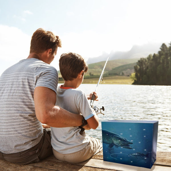 Father and son fishing from a jetty with the lure advent calendar beside them