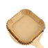 Square 20cm air fryer liner on a wooden board with a white background