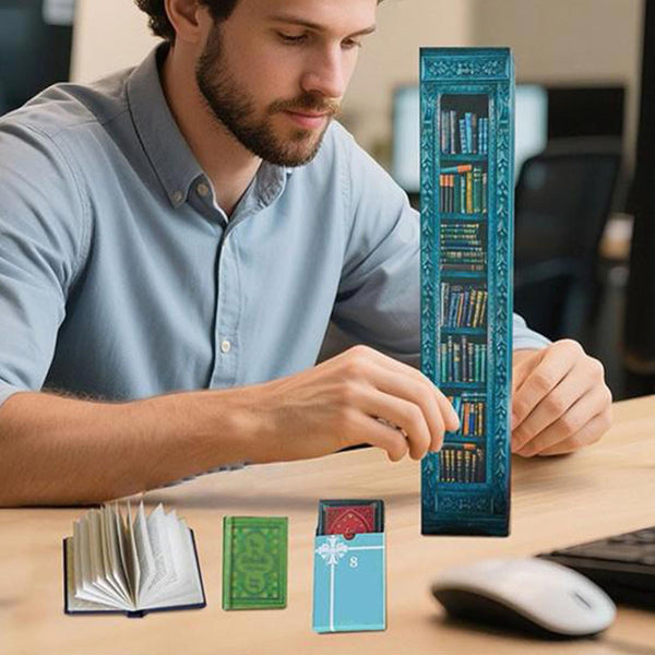 Man opening the book advent calendar at his desk with mini books