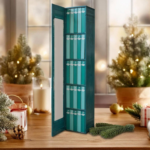Blue book advent calendar open on a table by a window